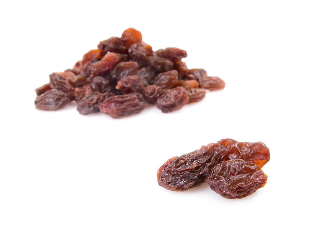 istock Pile of raisins isolated on white background 184752505
