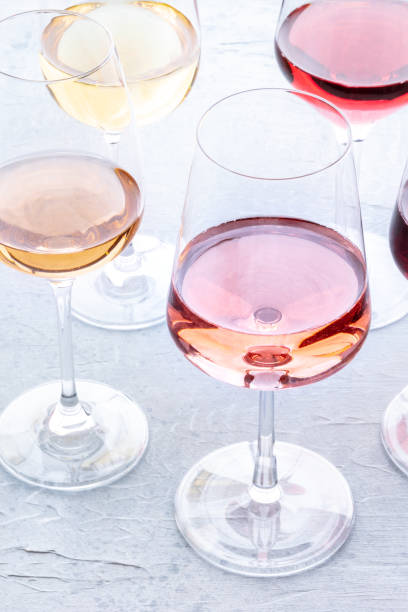 istock Wine glasses at a tasting. Rose and white wines, drinks on a table 1847531403