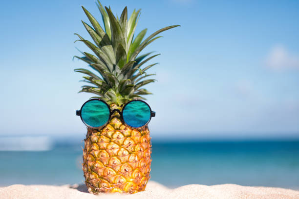 istock Two pineapples with trendy sunglasses in tropical paradise 1847539906