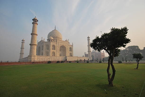 Agra, Rajasthan - India October 2000:  Side view to Taj Mahal which is one of the main tourist attractions worldwide and is a UNESCO World Heritage Site.