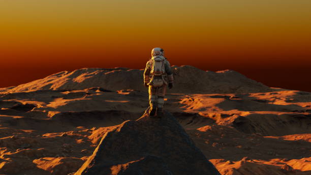 istock Astronaut on alien planet, red planet Mars. Space exploration, Martian colony, science, solar system. Rocky surface landscape. 3d render 1847548569