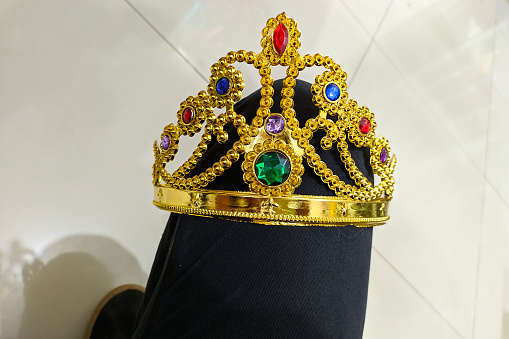 Gold crown on floor queen, leader, VIP person. Business concept success and achievement