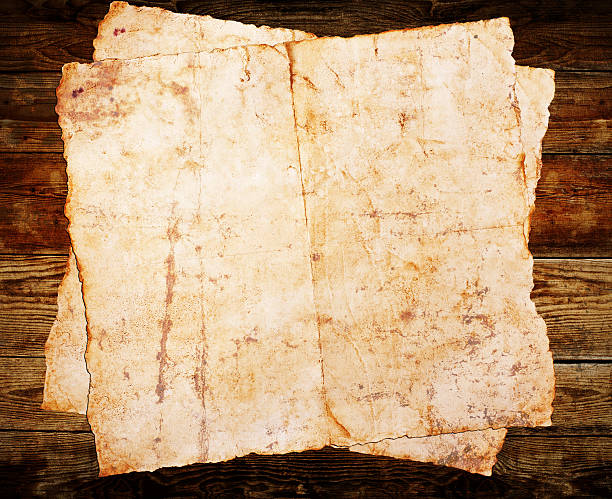 istock Old paper on the wood background 184756471