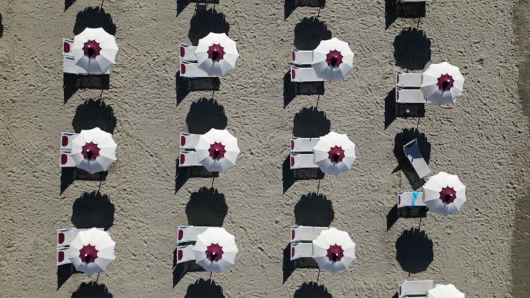 Aerial view of many beach umbrellas on the beach