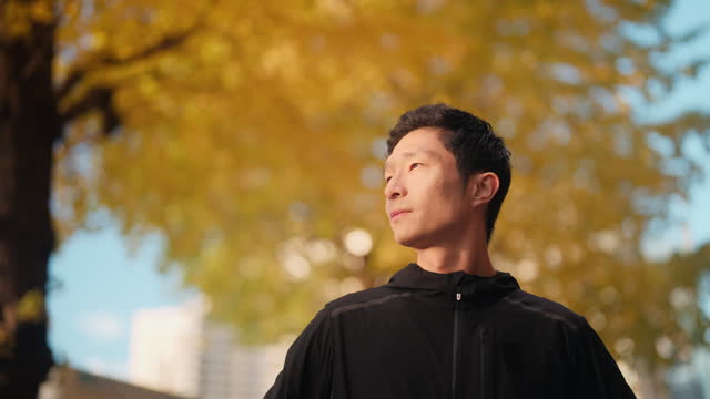 Portrait of male runner in city
