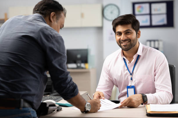 istock Customer with bank manager in office stock photo 1847589618