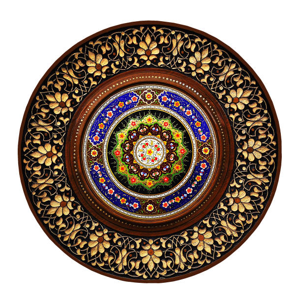 istock The carved wooden plate is decorated with bright oriental patterns. 1847608652