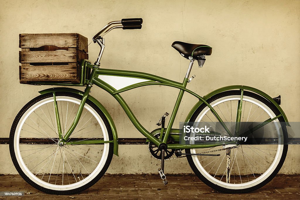Retro styled sepia image of a vintage bicycle Retro styled sepia image of a vintage beach cruiser bicycle with wooden crate Bicycle Stock Photo