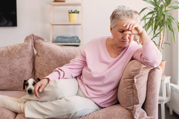istock middle aged lady looking away sit alone at home feel anxious lonely, sad 1847613772