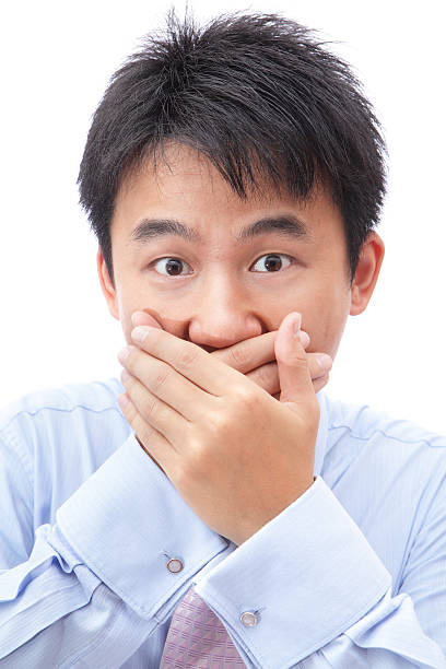 istock businessman covering his mouth with hand 184762873