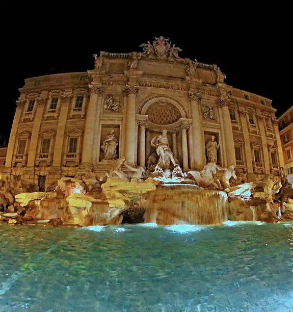 Photo of night view of the famous Trevi fountain in Rome