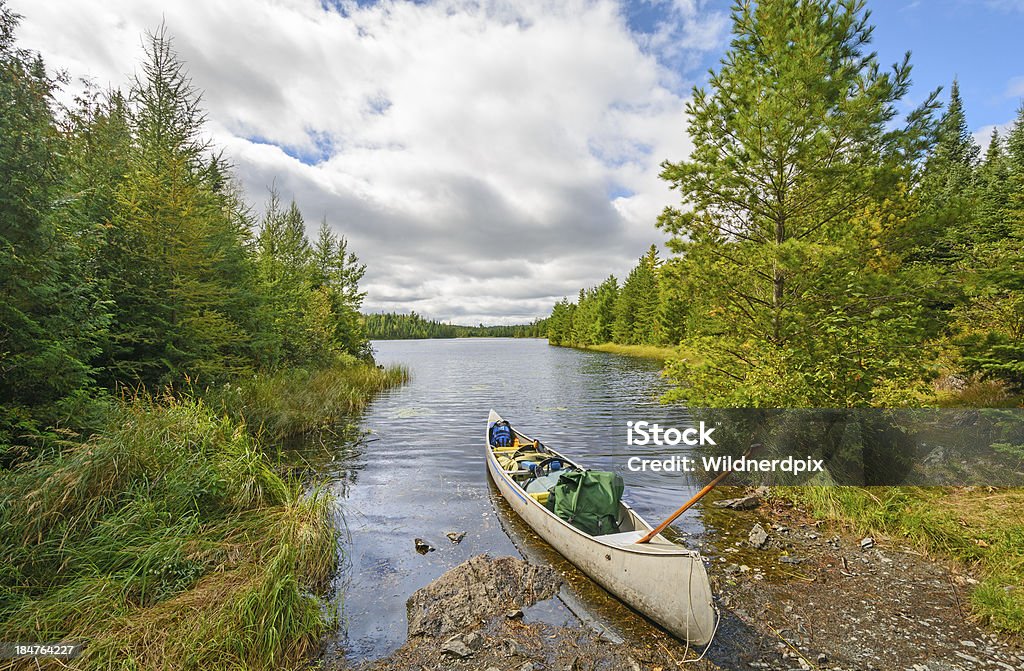 Heading out on a wilderness Lake Canoe ready to go on Jenny Lake in the Boundary Waters Canoe Stock Photo