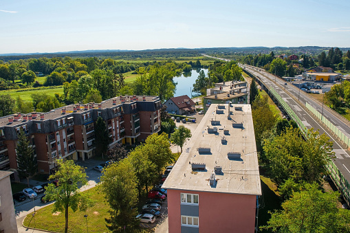 An aerial view over the residential rooftops of Karlovac, south of the historic centre, in Central Croatia. Looking towards the Korana River with the D1 highway on the right