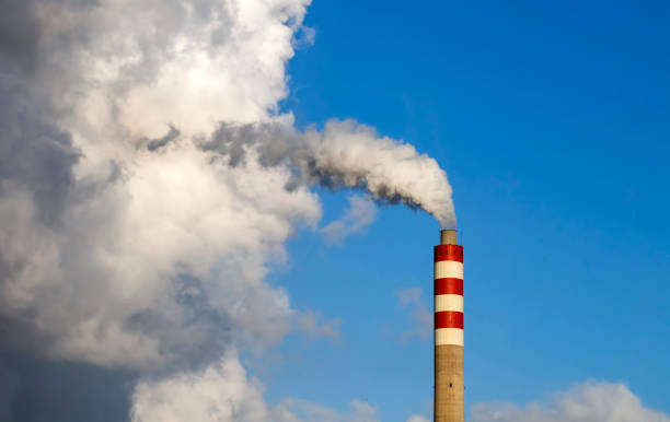 istock Factory chimney smoke with blue sky and clouds 1847654575