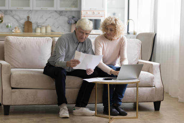 istock Serious senior retired couple counting domestic budget 1847656238