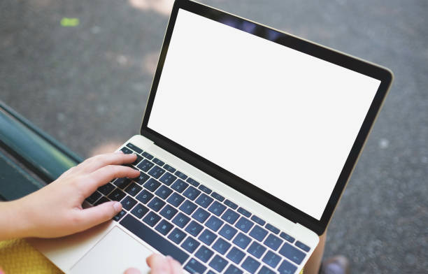 istock Hands holding devices featuring blank screens against a white background, perfect for advertising 1847676425