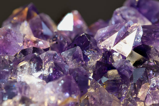 istock Amethyst geode on black background. Beautiful natural crystals gemstone. Extreme close up macro shot. 1847700149