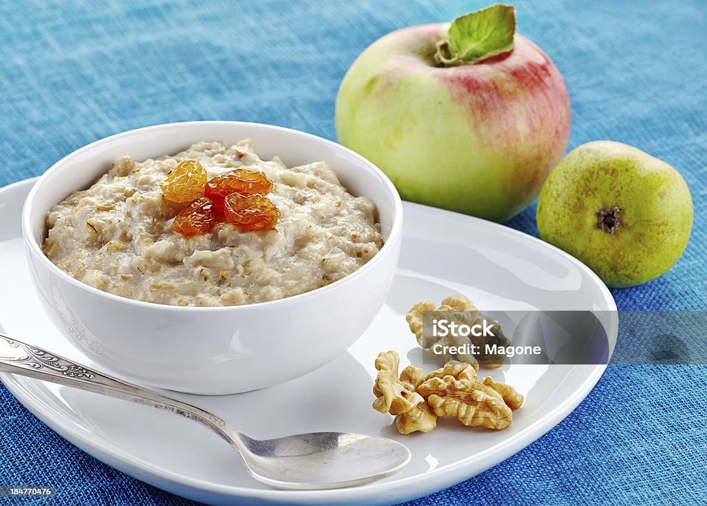 Bowl of oats porridge Oatmeal Stock Photo