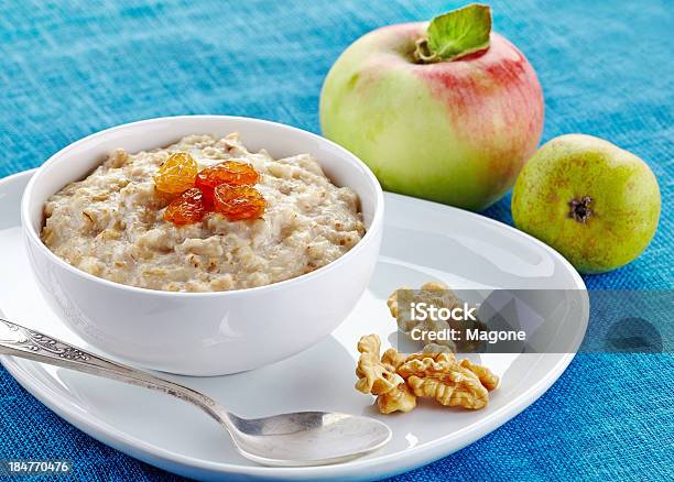 Bowl Of Oats Porridge Stock Photo - Download Image Now - Oatmeal, Apple - Fruit, Bowl