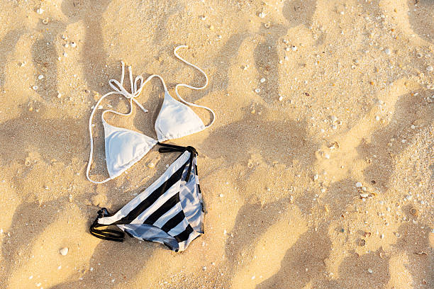 istock swimsuit in the sand 184772855