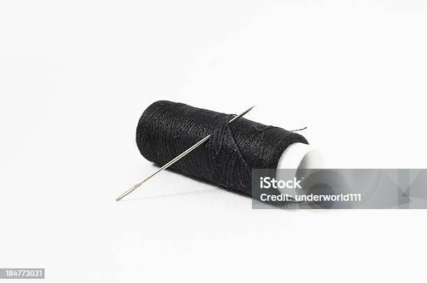 Needle And Black Thread Isolated On White Background Stock Photo