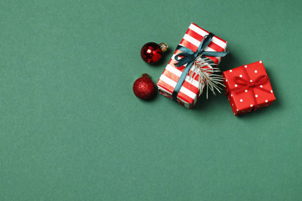 istock Composition of christmas gift boxes on green background. Top view. Place for text. 1847735315