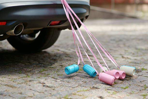 Rear view of a car with cans attached