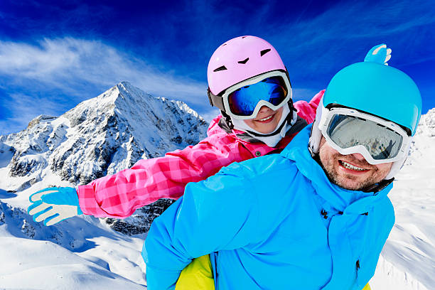 istock Family enjoying winter on sunny mountains  184773973