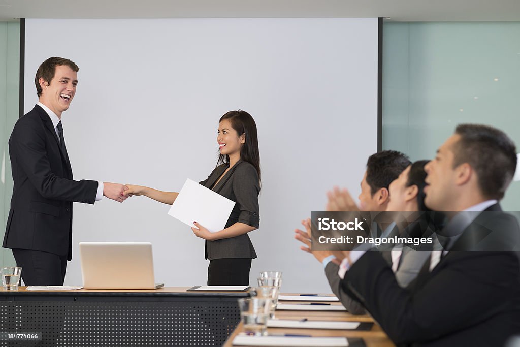 Successful collaboration Image of a business leader shaking hands to a member of the business seminar on the foreground Adult Stock Photo