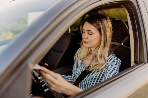 istock Young woman driving 1847744100