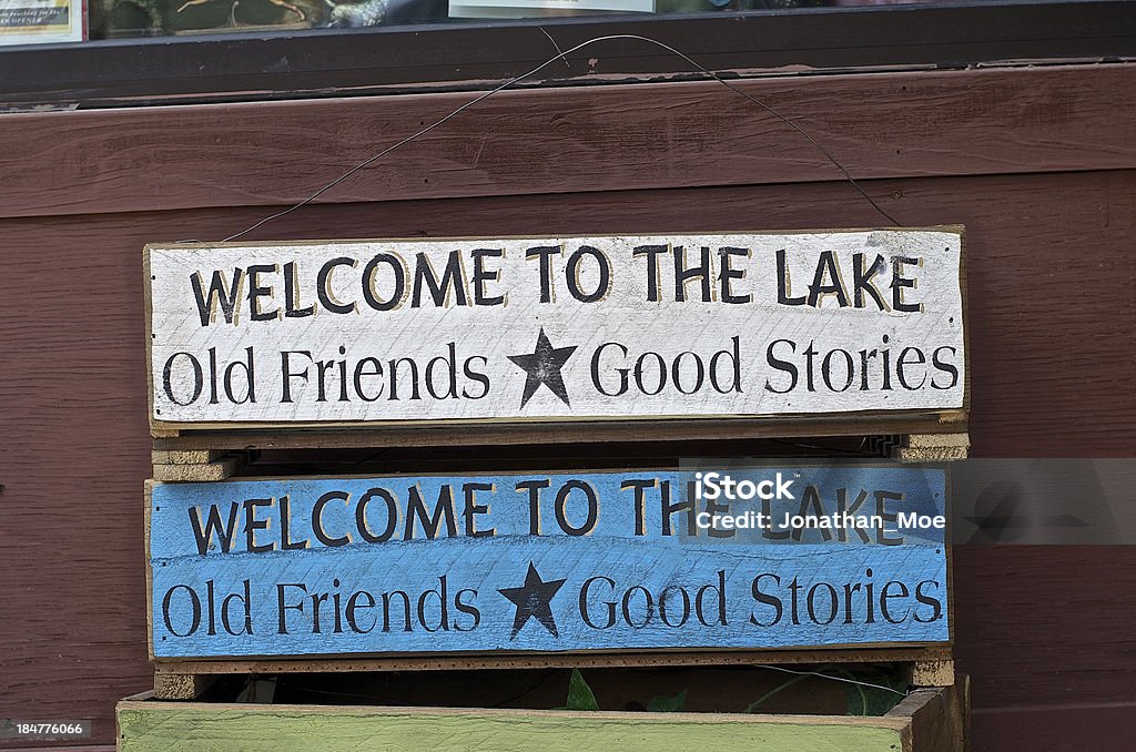 Welcome to the Lake Come old crates that were sitting outside of a little thrift store in a small town. Antique Stock Photo