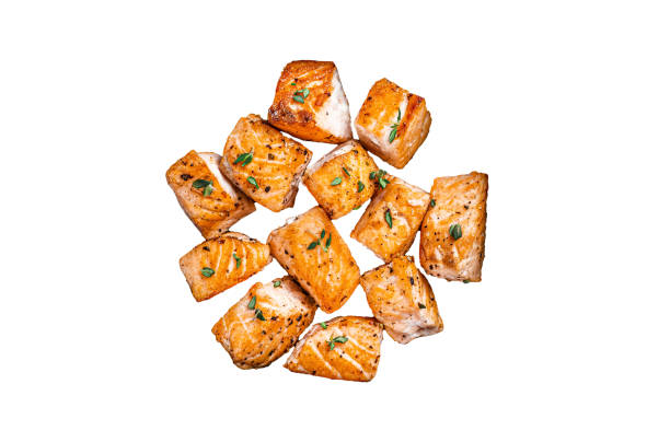 Roasted salmon or trout fish in a pan.  Isolated, white background.
