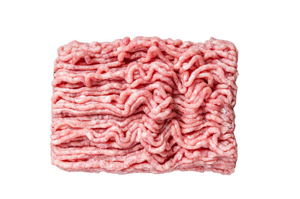 istock Raw ground chicken or turkey meat on brown table.  Isolated, white background. 1847761369
