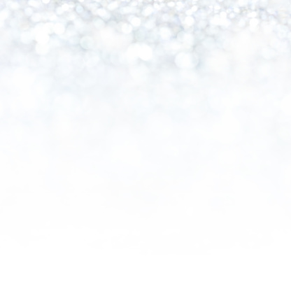 Silver lights Abstract  Christmas background. Magic shining white dust. Holiday New year Glitter Defocused Background