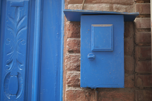 blue color mailbox postbox letter on wall