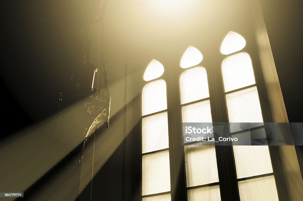 Rays of light through glass in a window church Quebec, Canada Window Stock Photo