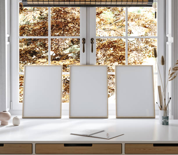istock Frame mockup close up at home, workplace near window with empty wooden frame 1847801440