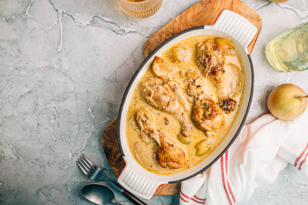 istock Chicken Normandy served in an enamel-coated cast-iron roaster 1847808315