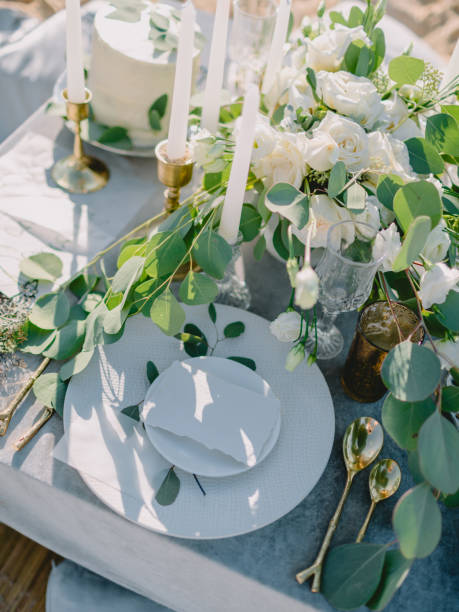 istock Elegant Table setting with a blank card decorated with eucalyptus branches. Wedding Mockup. Romantic table with paper invitation card. 1847820672