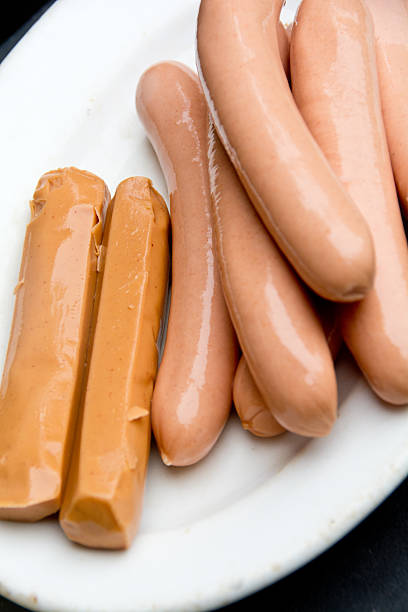 istock Meat and vegetarian hotdogs on a white plate 184782311