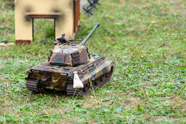 istock Camouflage German WW2 Panzerkampfwagen VIB Tiger II model in green grass 1847826813
