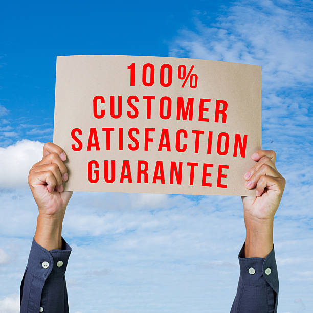 istock Hands holding brown paper with 100% customer satisfaction 184782925