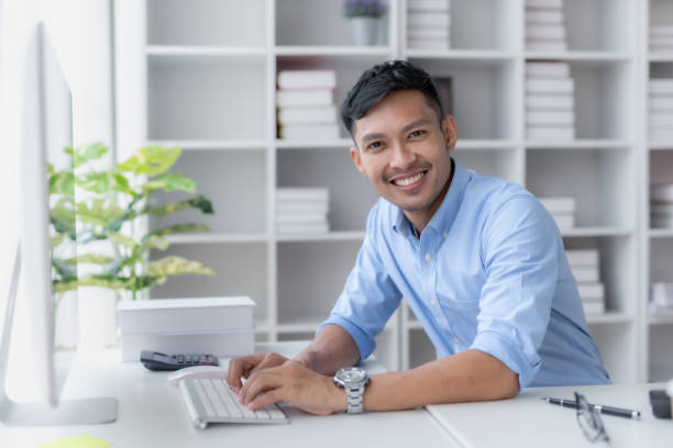 istock Committed asian businessman sitting working at office with a laptop computer. 1847834931