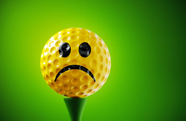 Golfer in a red shirt celebrating after sinking a great putt.