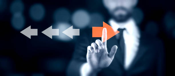 istock Point to orange arrow and different direction facing opposite 1847862488