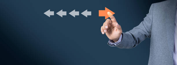 istock Point to orange arrow and different direction facing opposite 1847863018