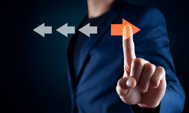istock Point to orange arrow and different direction facing opposite 1847863026