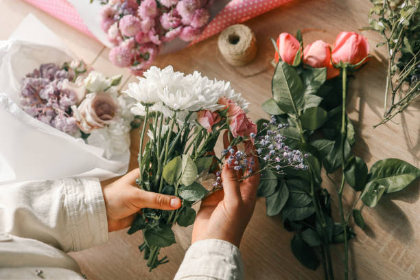 istock Florist at work. Woman making autumn floral decorations 1847866765