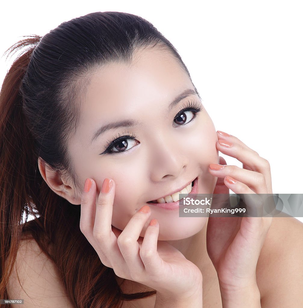 Asian beauty skin care woman smiling close-up Asian beauty skin care woman smiling close-up, Beautiful young woman touching her face looking to the side. Isolated on white background Adult Stock Photo