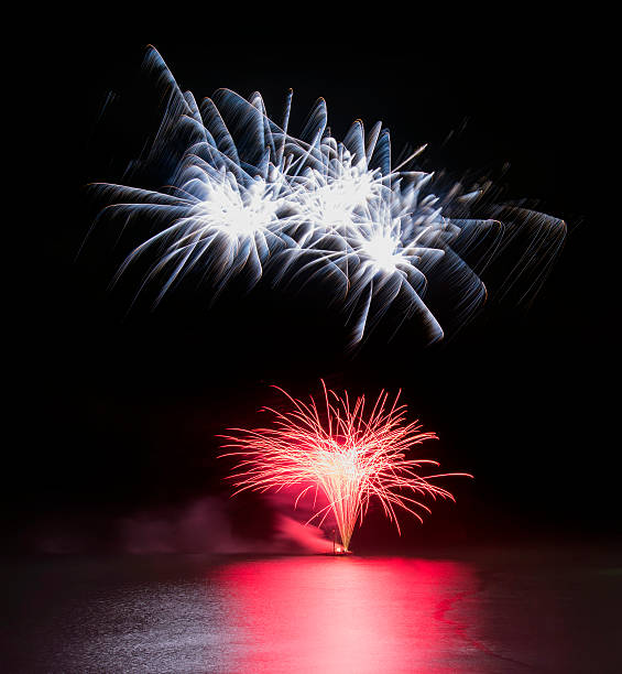 istock Fireworks display over sea with reflections in water 184787306